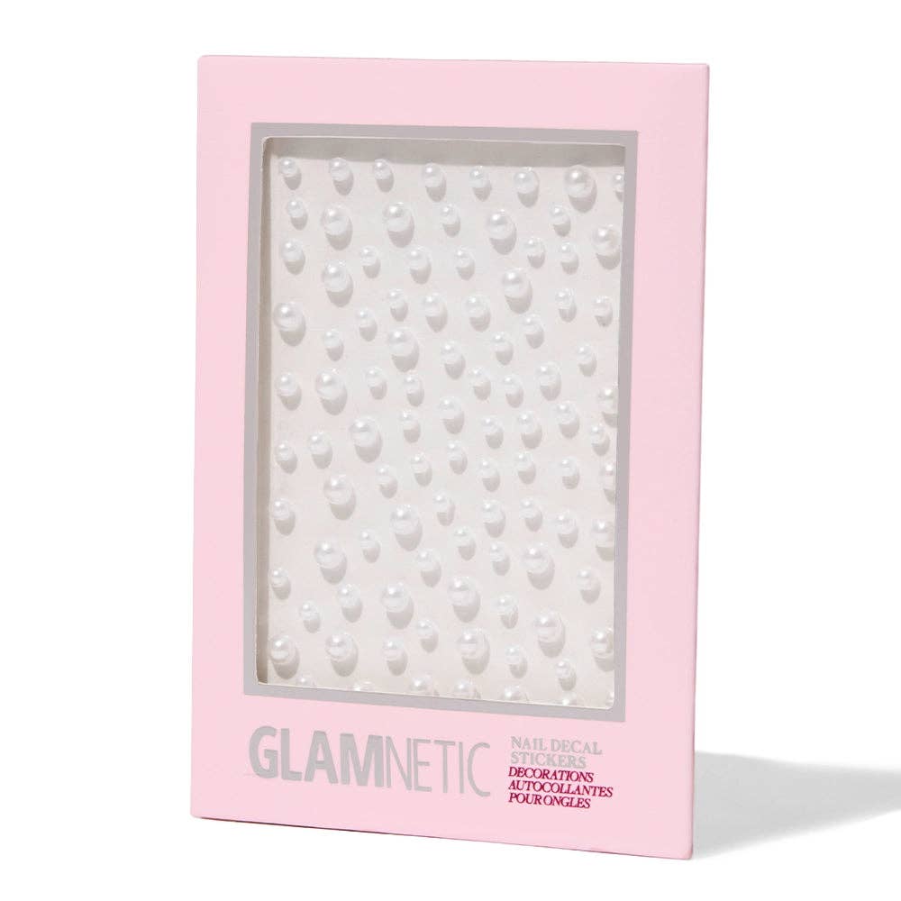 Glamnetic Nail Decal Stickers packaging in pink box showing a sheet of white pearl nail gems in assorted sizes