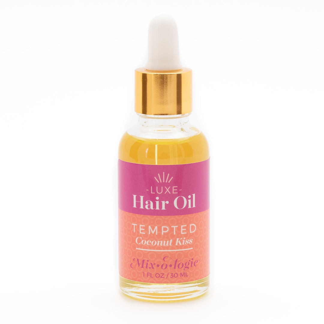 Mixologie Luxe Hair Oil in Tempted Coconut Kiss, 1 fl oz, clear dropper bottle with gold cap and hot pink to coral gradient label