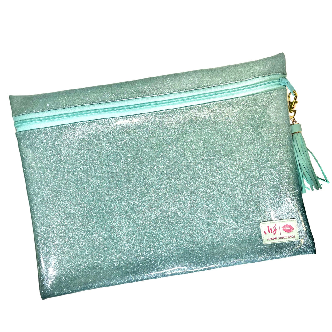 Makeup Junkie Bags mint glitter large zip makeup bag with mint tassel zipper pull and branded patch, front view on white background