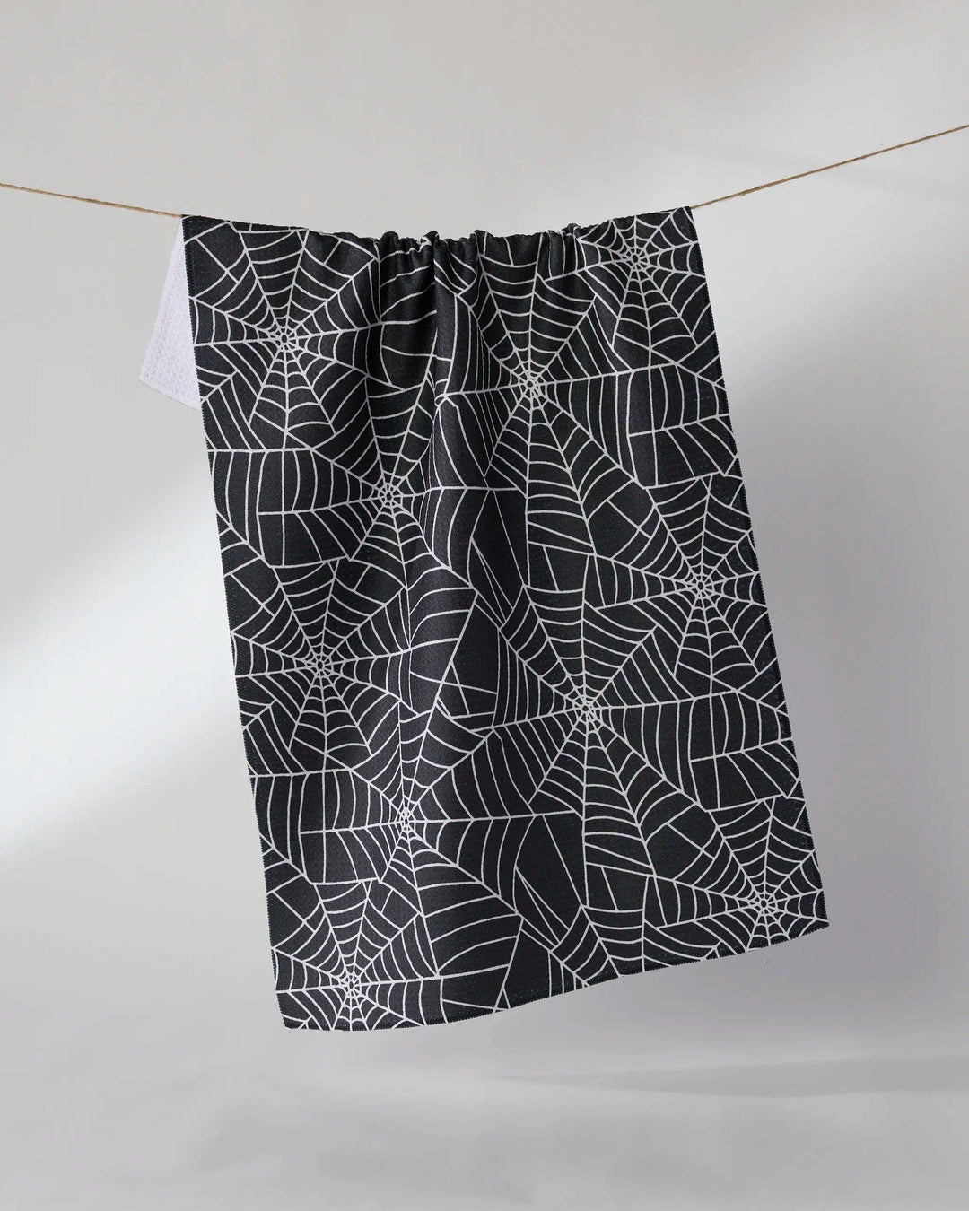 Whisper Web Black Tea Towel by Geometry