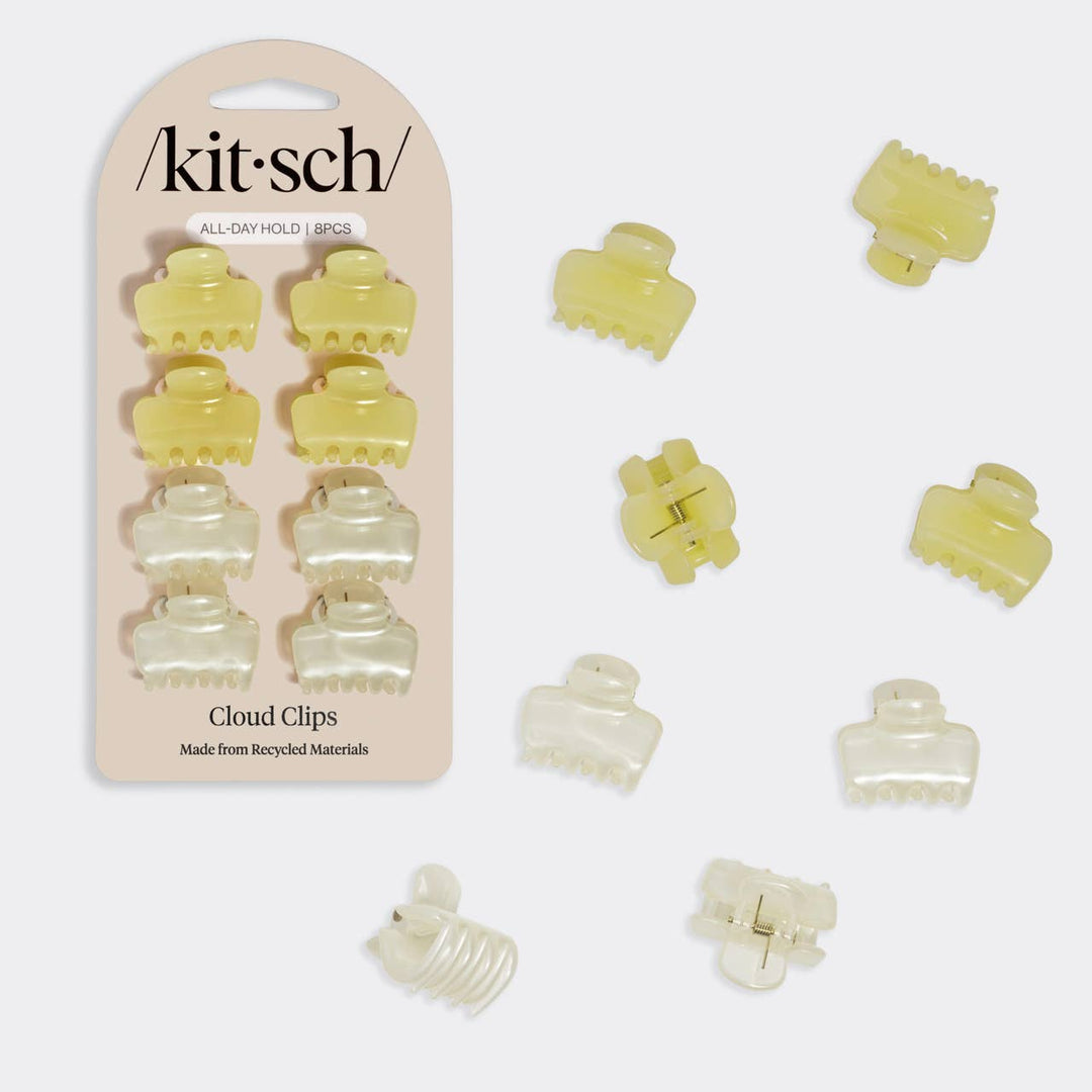 Kitsch Cloud Clips 8-piece set in butter yellow and pearl white mini claw clips, shown next to their retail packaging card labeled "All Day Hold" and "Made from Recycled Materials," on a white background.