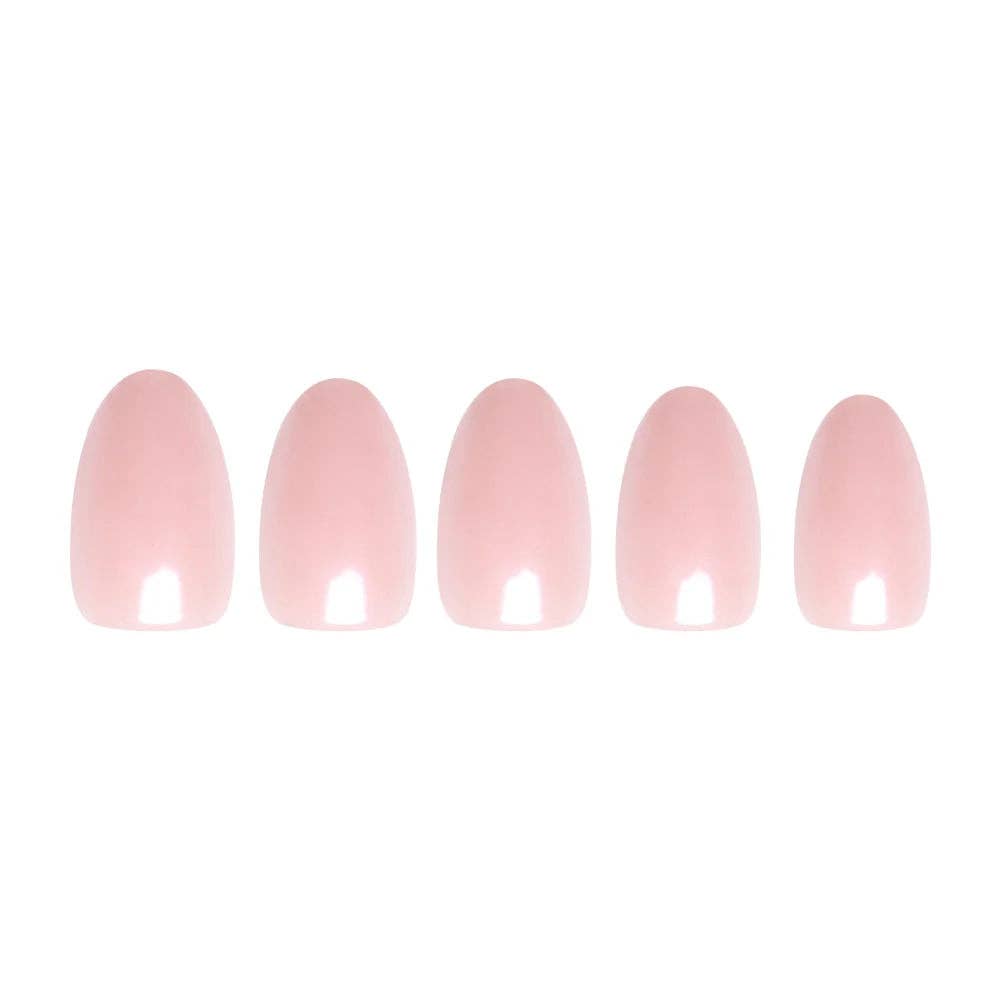 Flatlay of 5 blush pink short oval press-on nails in graduating sizes showing glossy finish on white background
