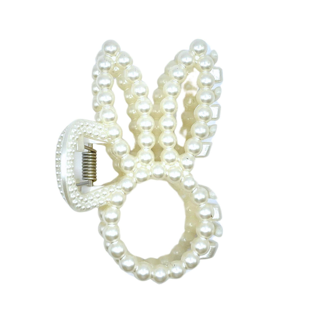 Pearl beaded bunny ear claw clip product shot on white background showing front view of bunny ear silhouette and spring claw mechanism.