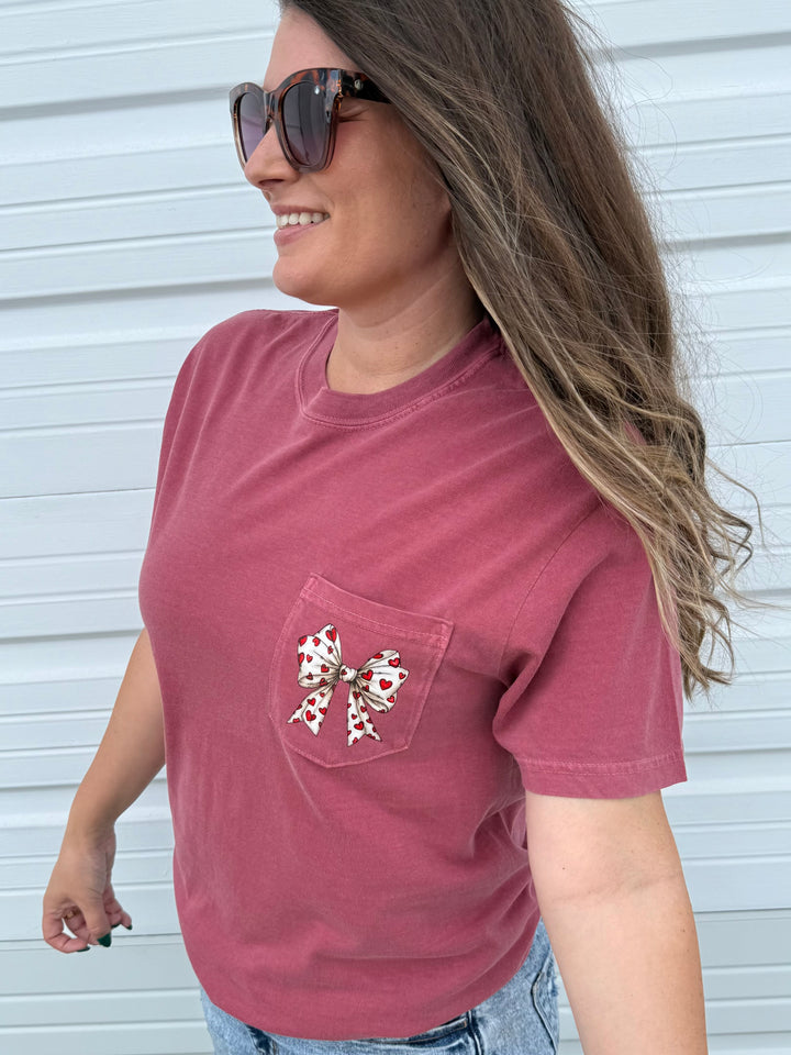 by PrepO: Heart Print Bow Pocket Graphic Tee (Ships in 2-3 Weeks)