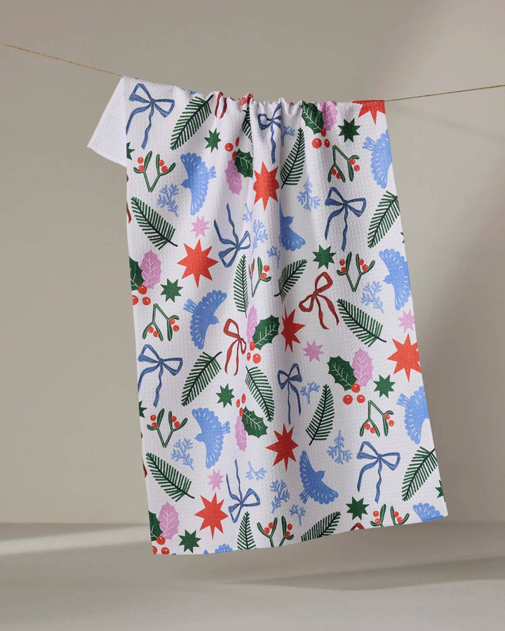 Christmas Garden Party Tea Towel by Geometry