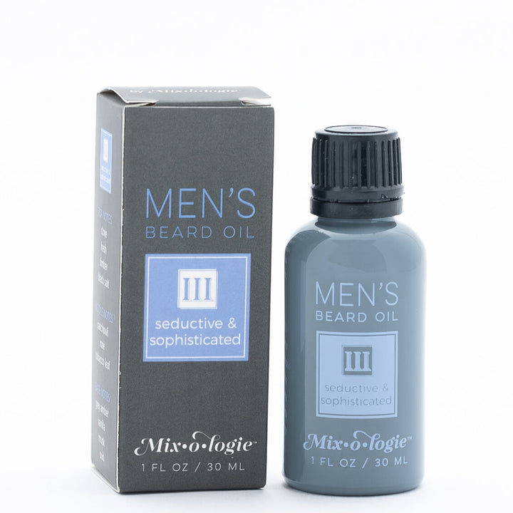 Mixologie Men's Beard Oil III Seductive & Sophisticated, 1 fl oz, slate gray bottle with black cap next to matching dark gray box with periwinkle blue accent label on white background