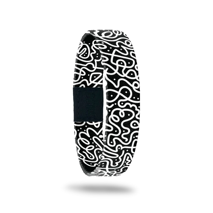 This is a reversible wristband. One one side is a black base with white swirls all over. The inside is the same design and reads Believe In Yourself. It is a single. 