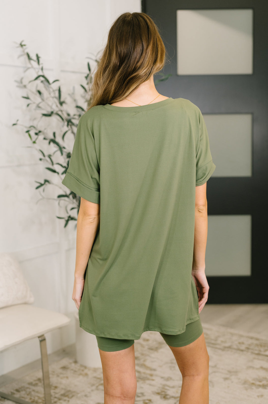 Back view — light olive green oversized V-neck tee and biker shorts set