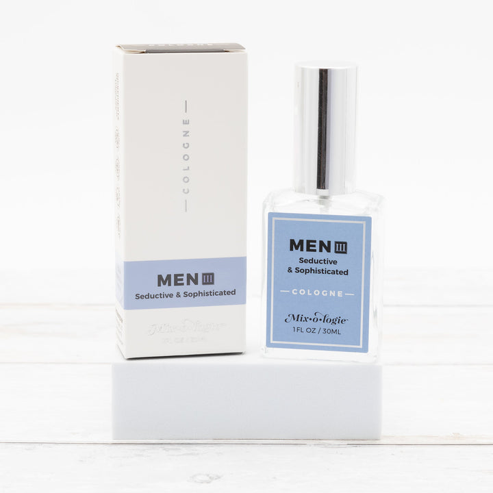 Mixologie Men III Seductive & Sophisticated Cologne, 1 fl oz, clear square glass spray bottle with silver cap and light blue label with matching white and blue box