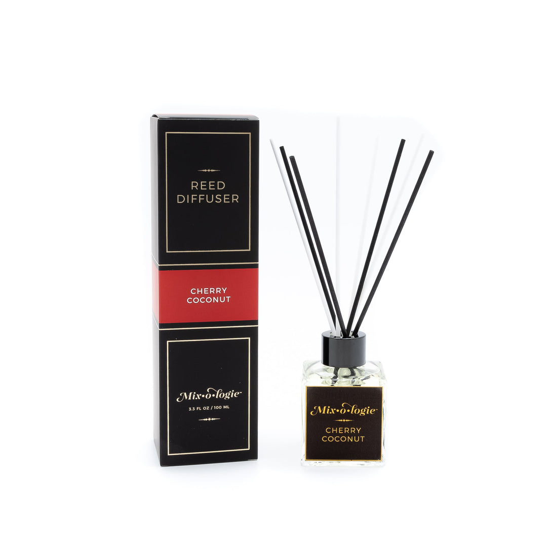 Mixologie Reed Diffuser in Cherry Coconut, 3.3 fl oz, clear square glass bottle with black cap and black label with red accent band, with matching black and red box