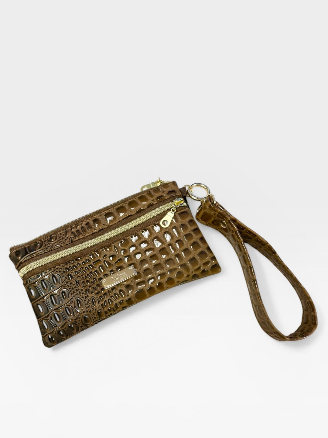 Olive green crocodile embossed faux leather wristlet clutch with dual gold zippers, gold hardware ring, and matching wrist strap, on a white background.
