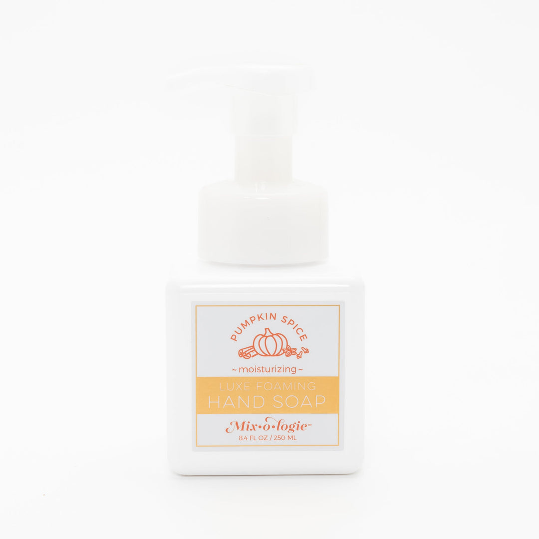 Mixologie Luxe Foaming Hand Soap in Pumpkin Spice, 8.4 fl oz, white square pump bottle with gold-bordered label and orange pumpkin and cinnamon stick illustration on white background