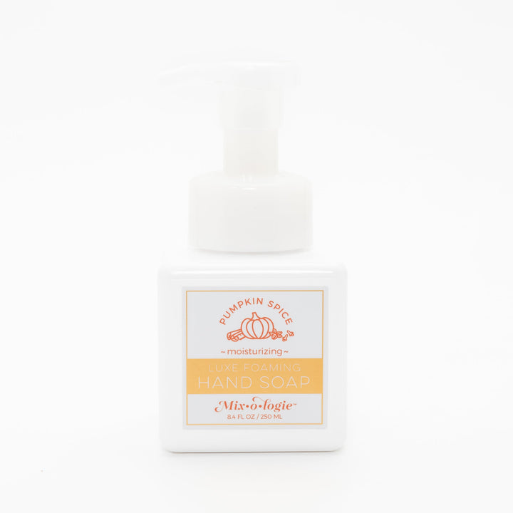 Mixologie Luxe Foaming Hand Soap in Pumpkin Spice, 8.4 fl oz, white square pump bottle with gold-bordered label and orange pumpkin and cinnamon stick illustration on white background