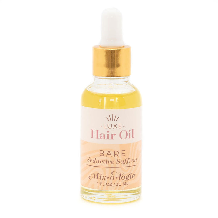 Mixologie Luxe Hair Oil in Bare Seductive Saffron, 1 fl oz, clear dropper bottle with gold cap and blush peach label
