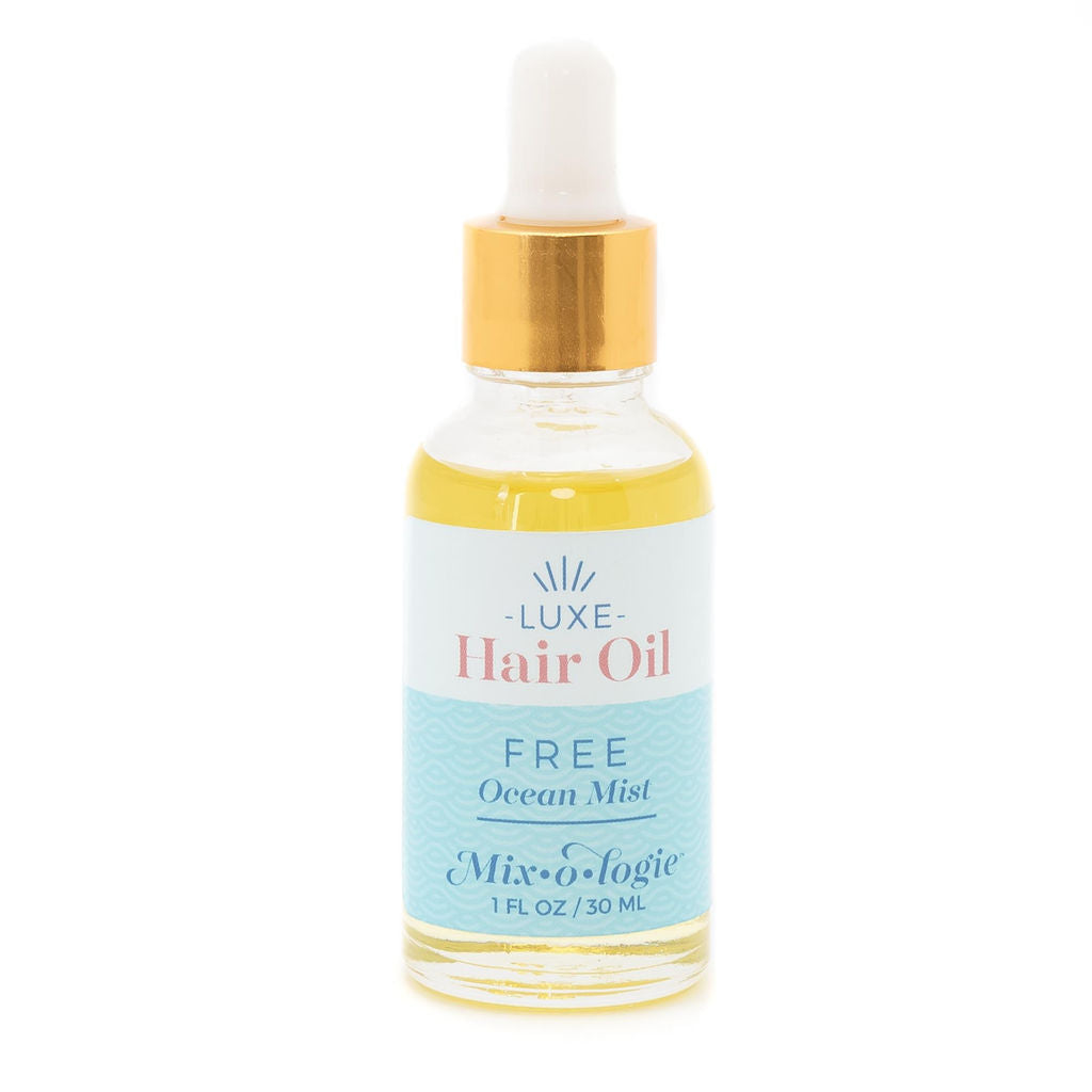 Mixologie Luxe Hair Oil in Free Ocean Mist, 1 fl oz, clear dropper bottle with gold cap and light blue label
