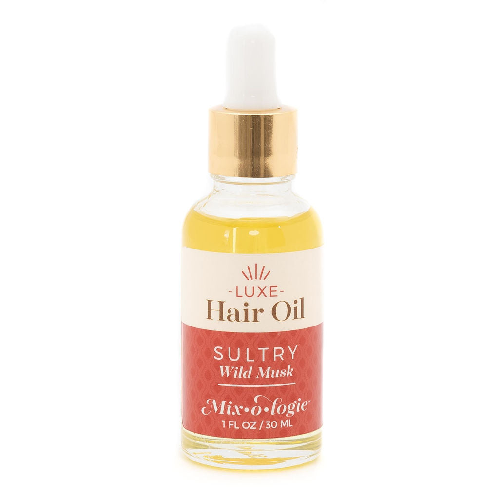 Mixologie Luxe Hair Oil in Sultry Wild Musk, 1 fl oz, clear dropper bottle with gold cap and cream and red label
