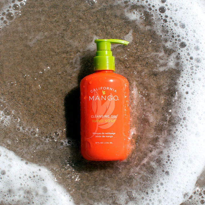 California Mango Cleansing Gel Hand Soap 8 fl oz pump bottle surrounded by soapy water and bubbles
