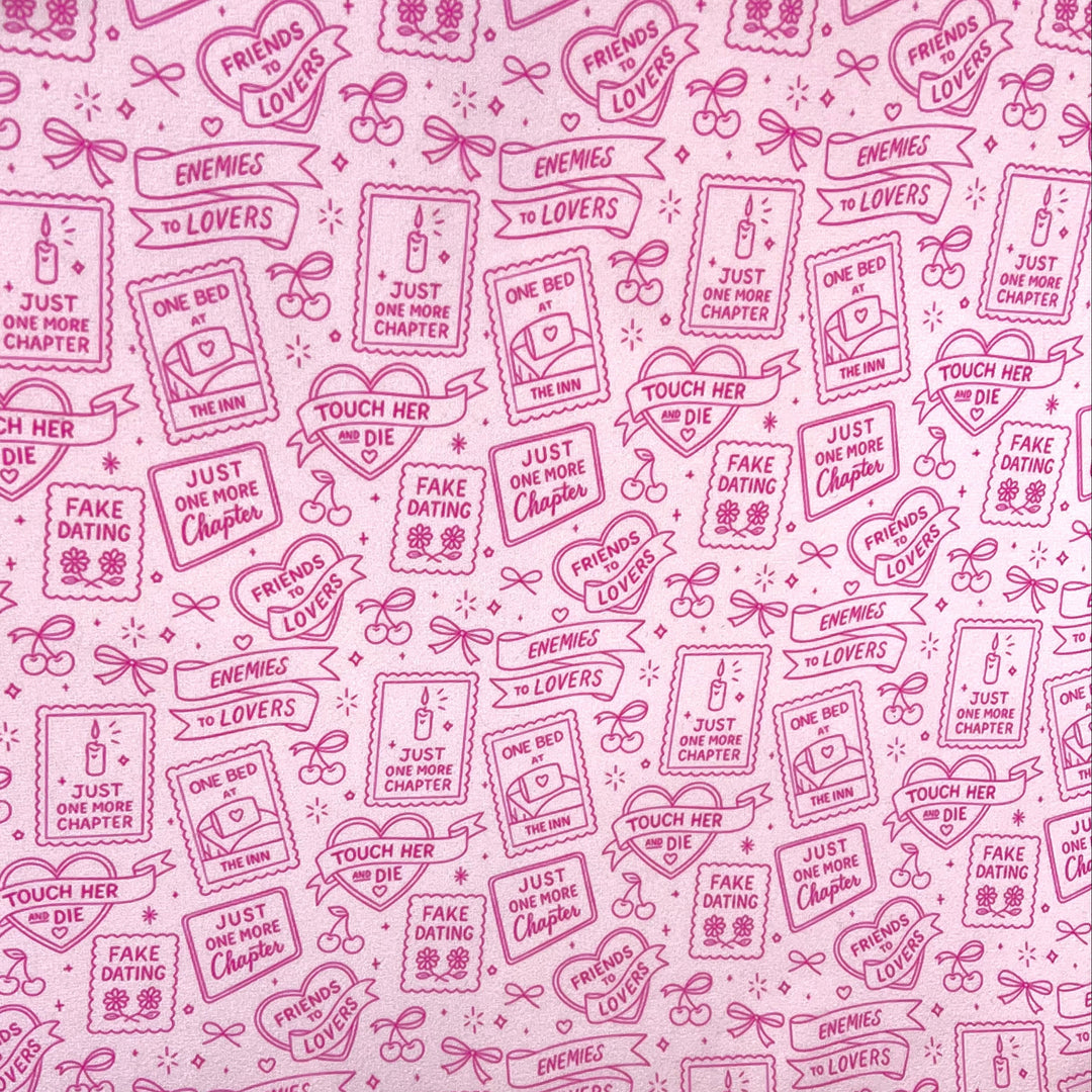 Pink bookish romance print fabric featuring enemies to lovers, friends to lovers, fake dating, one bed, just one more chapter, and touch her and die romance trope illustrations