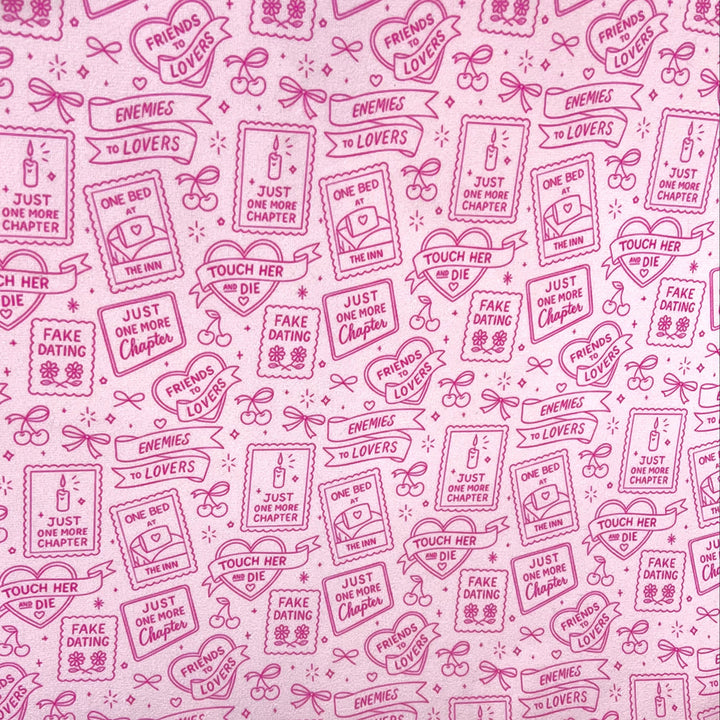 Pink bookish romance print fabric featuring enemies to lovers, friends to lovers, fake dating, one bed, just one more chapter, and touch her and die romance trope illustrations