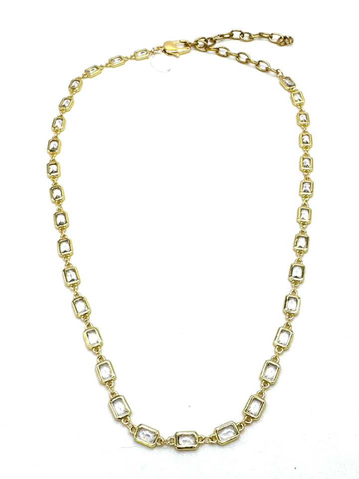 Gold chain necklace on a white background