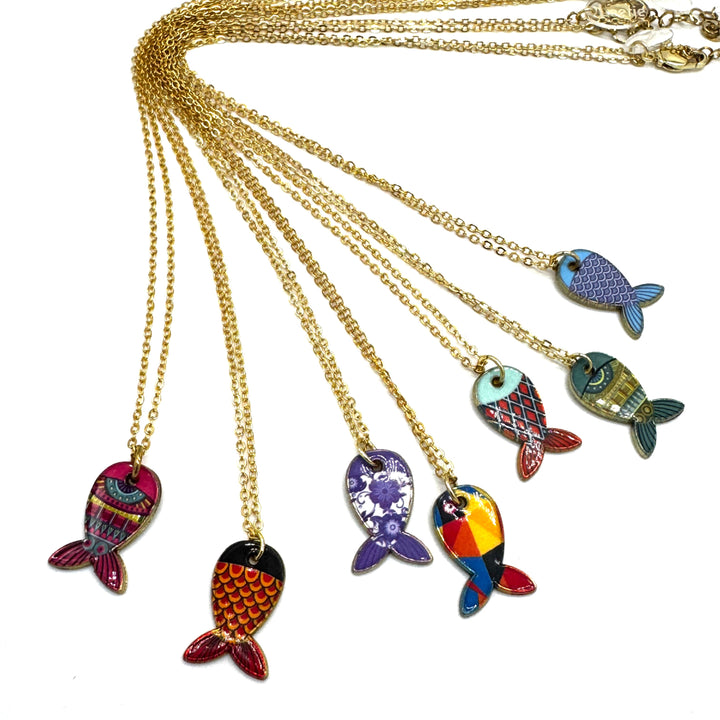 A set of gold chain necklaces with colorful fish-shaped pendants, displayed against a plain white background.