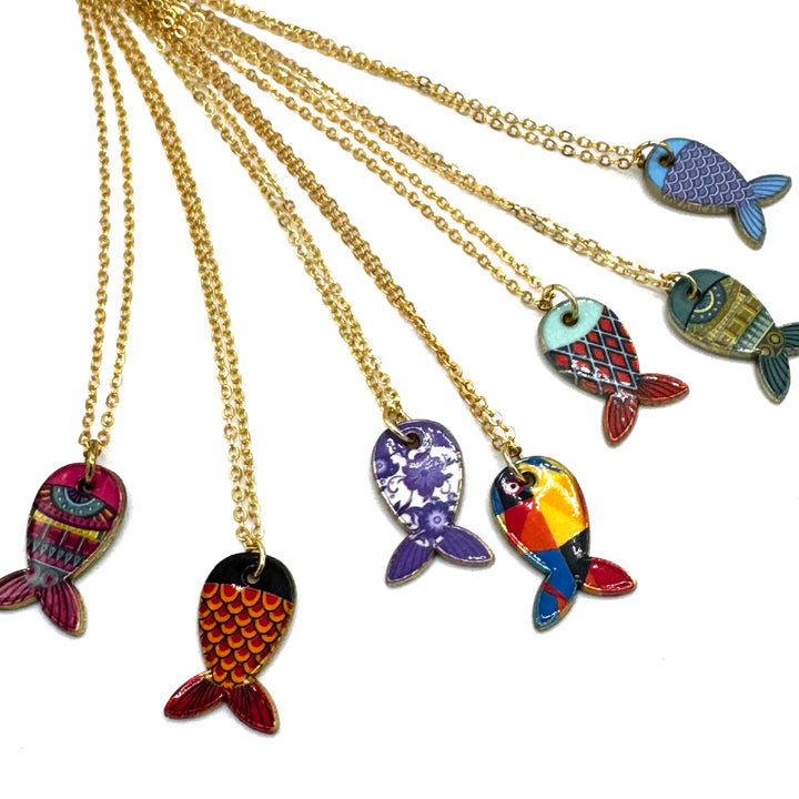 Six gold chain necklaces with colorful fish-shaped pendants, displayed against a solid white background.