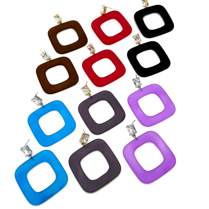 Twelve square drop earrings with rounded corners in assorted colors including blue, brown, red, black, purple, and gray, arranged on a plain white background.