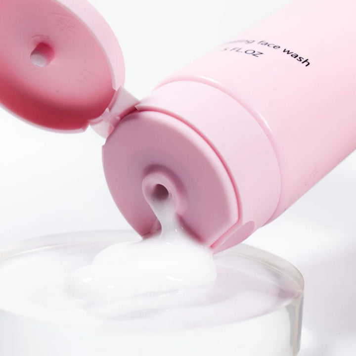 Beaut. The Cleanse hydrating face wash 4 FL.OZ in a soft pink squeeze tube, standing upright against a pink background.