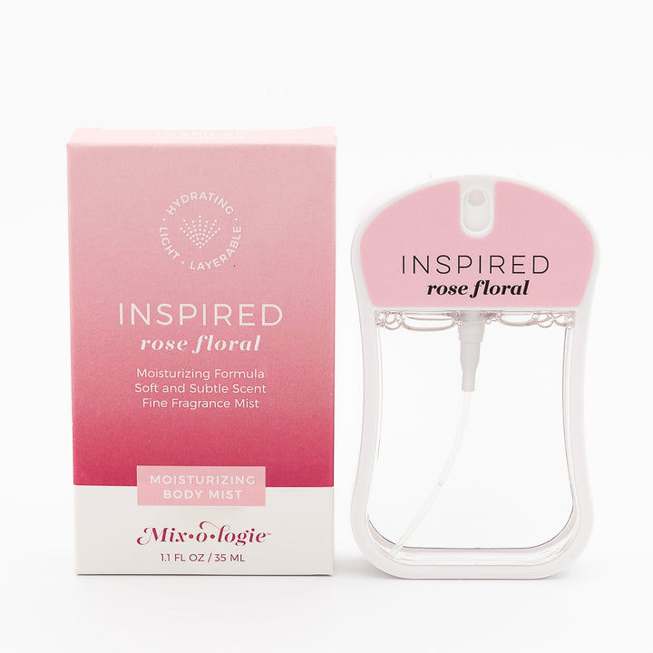 Mixologie Moisturizing Body Mist in Inspired Rose Floral, 1.1 fl oz, clear card-shaped spray bottle with blush pink cap next to pink to white gradient box on white background
