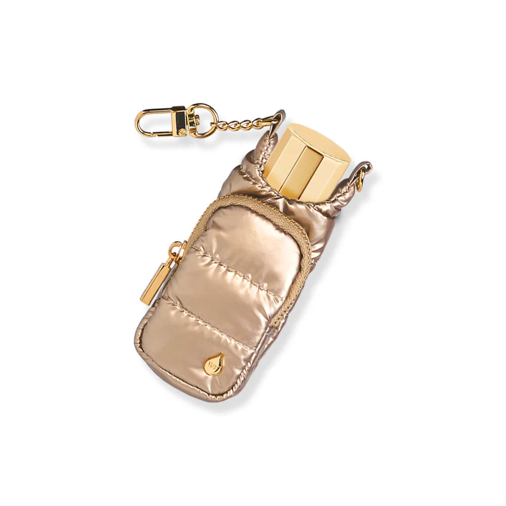 Champagne gold metallic quilted puffer lip balm keychain holder with gold lip balm tube inserted, gold zipper pocket, and gold swivel clip chain