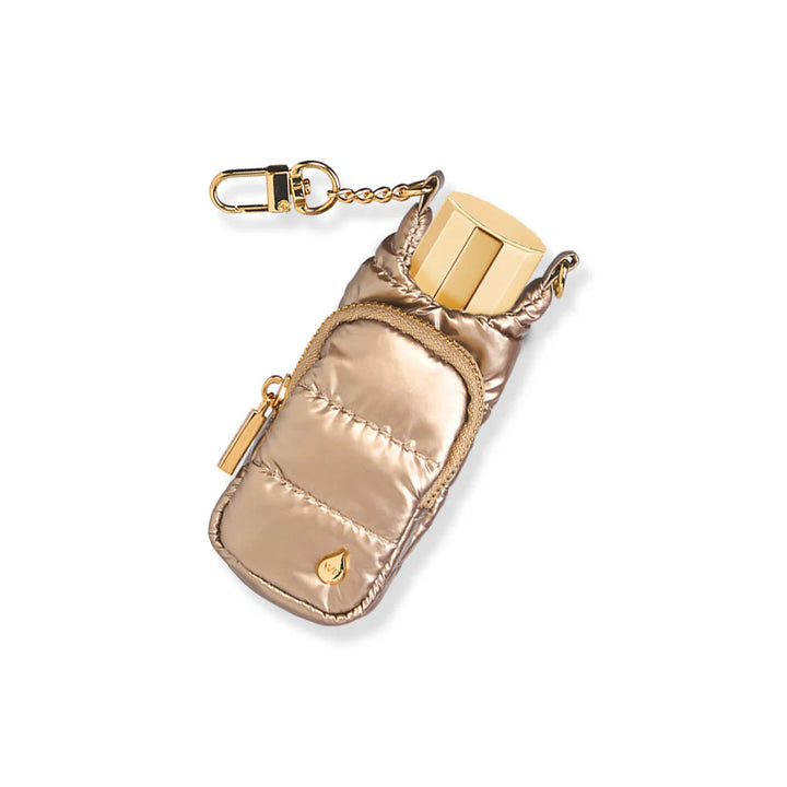 Champagne gold metallic quilted puffer lip balm keychain holder with gold lip balm tube inserted, gold zipper pocket, and gold swivel clip chain