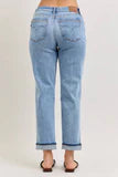 Back view of light wash distressed straight-leg jeans with cuffed hem in regular size
