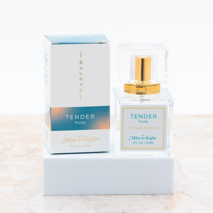 Mixologie Parfum in Tender Fruity, 1 fl oz, clear square glass spray bottle with gold cap and teal and peach gradient box