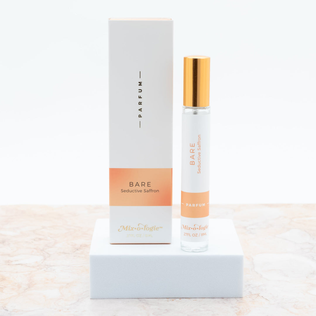 Mixologie Parfum in Bare Seductive Saffron, 0.27 fl oz, clear glass roller bottle with gold cap and peach gradient box
