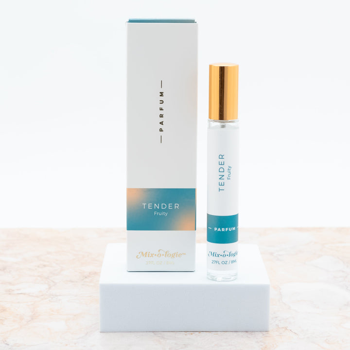 Mixologie Parfum in Tender Fruity, 0.27 fl oz, clear glass roller bottle with gold cap and teal and peach gradient box
