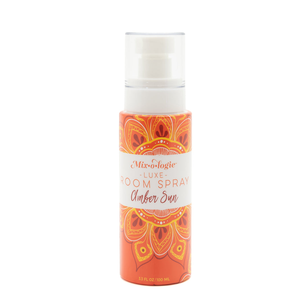 Mixologie Luxe Room Spray in Amber Sun, 3.3 fl oz, clear pump bottle with orange mandala medallion illustrated label