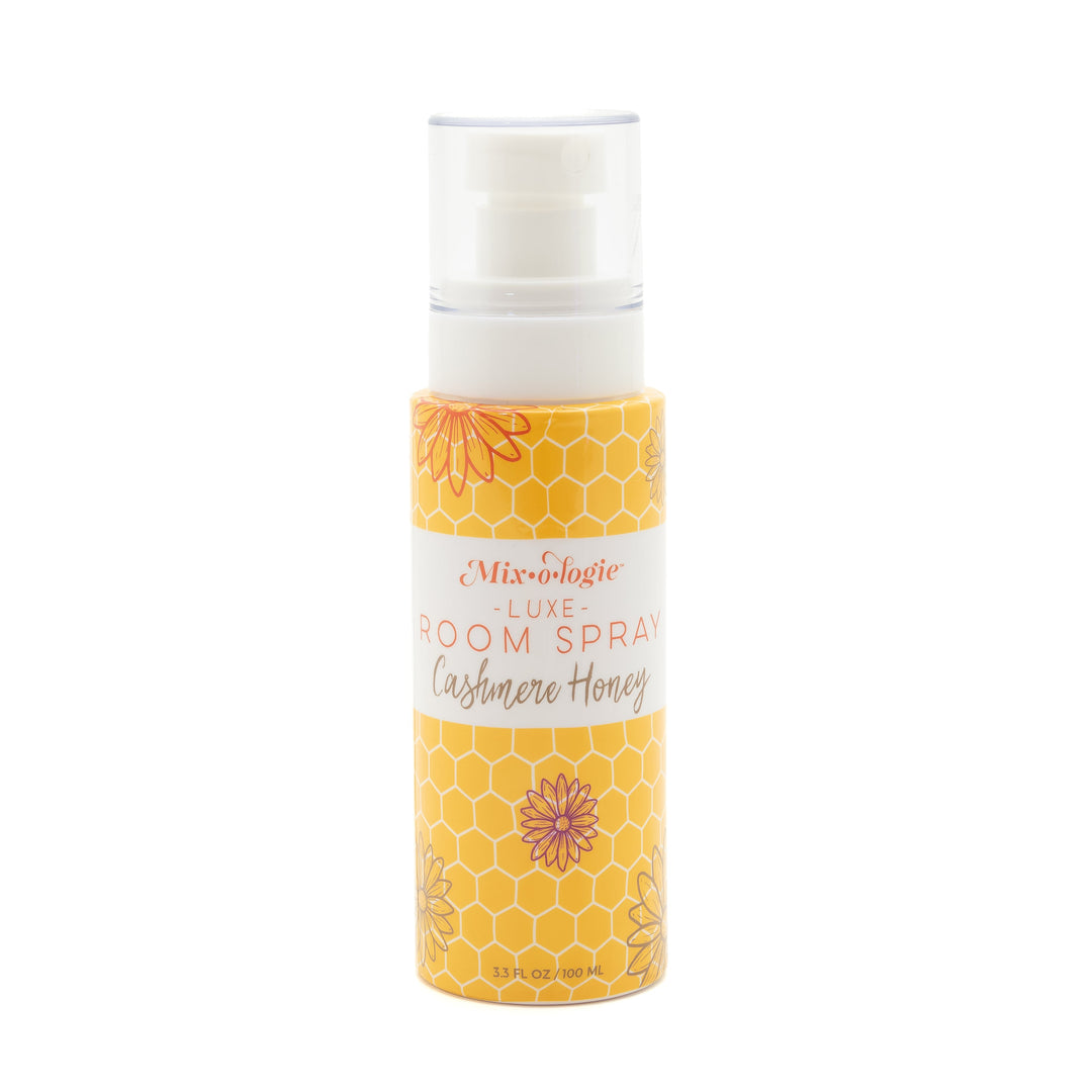 Mixologie Luxe Room Spray in Cashmere Honey, 3.3 fl oz, clear pump bottle with yellow honeycomb and floral illustrated label