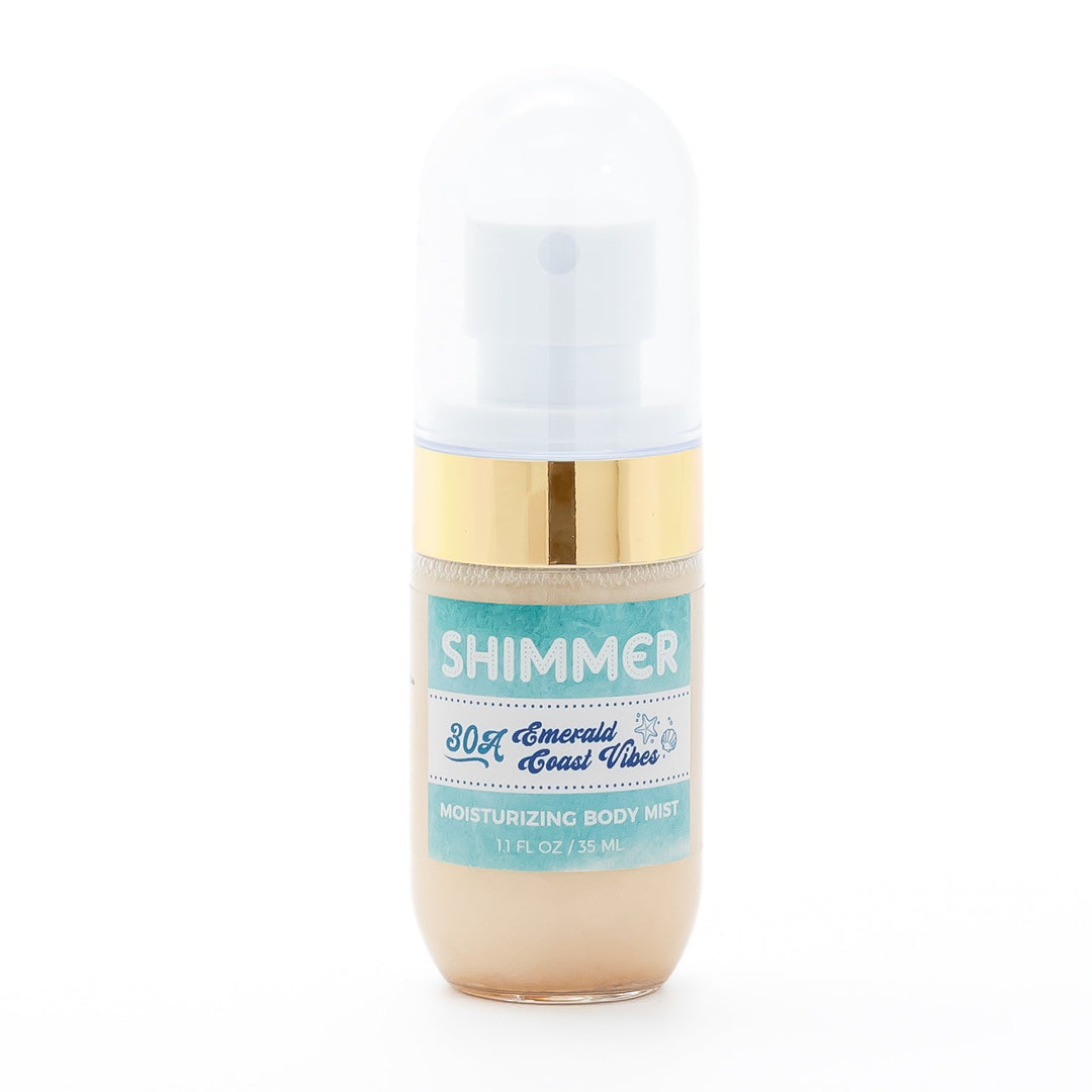 Mixologie Shimmer Moisturizing Body Mist in 30A Emerald Coast Vibes, 1.1 fl oz, clear foaming bottle with gold band, white pump cap, and teal label