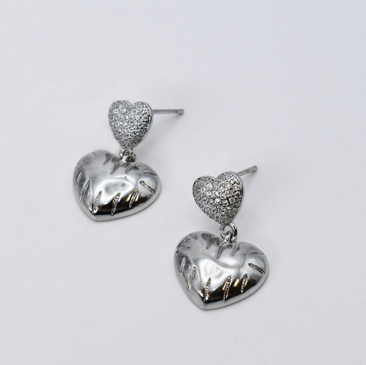 Silver Cupid Heart Studs by Treasure Jewels