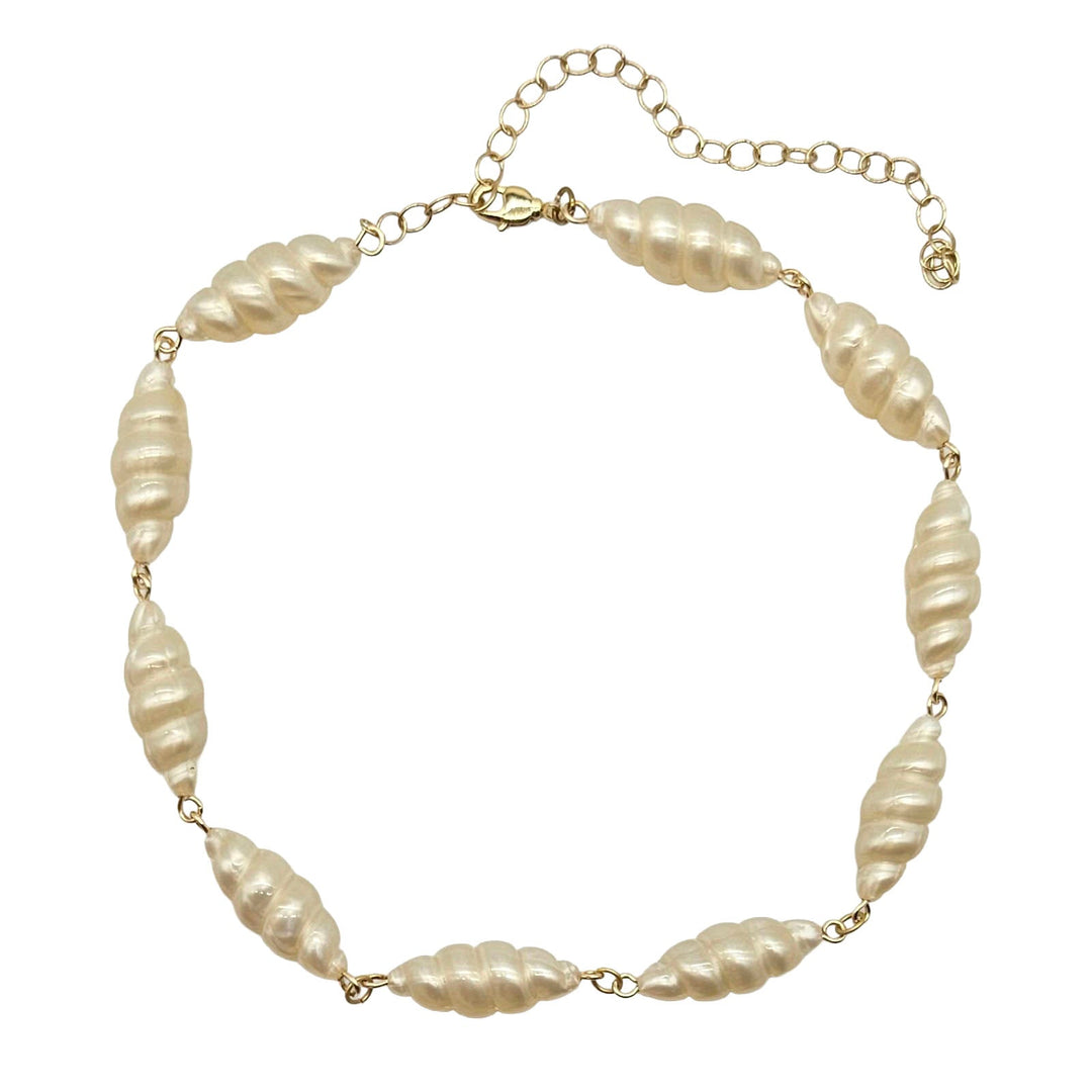 Lucite pearl necklace with gold chain on a white background