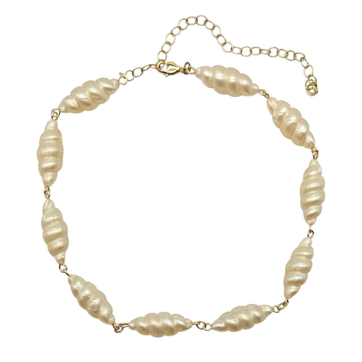 Lucite pearl necklace with gold chain on a white background