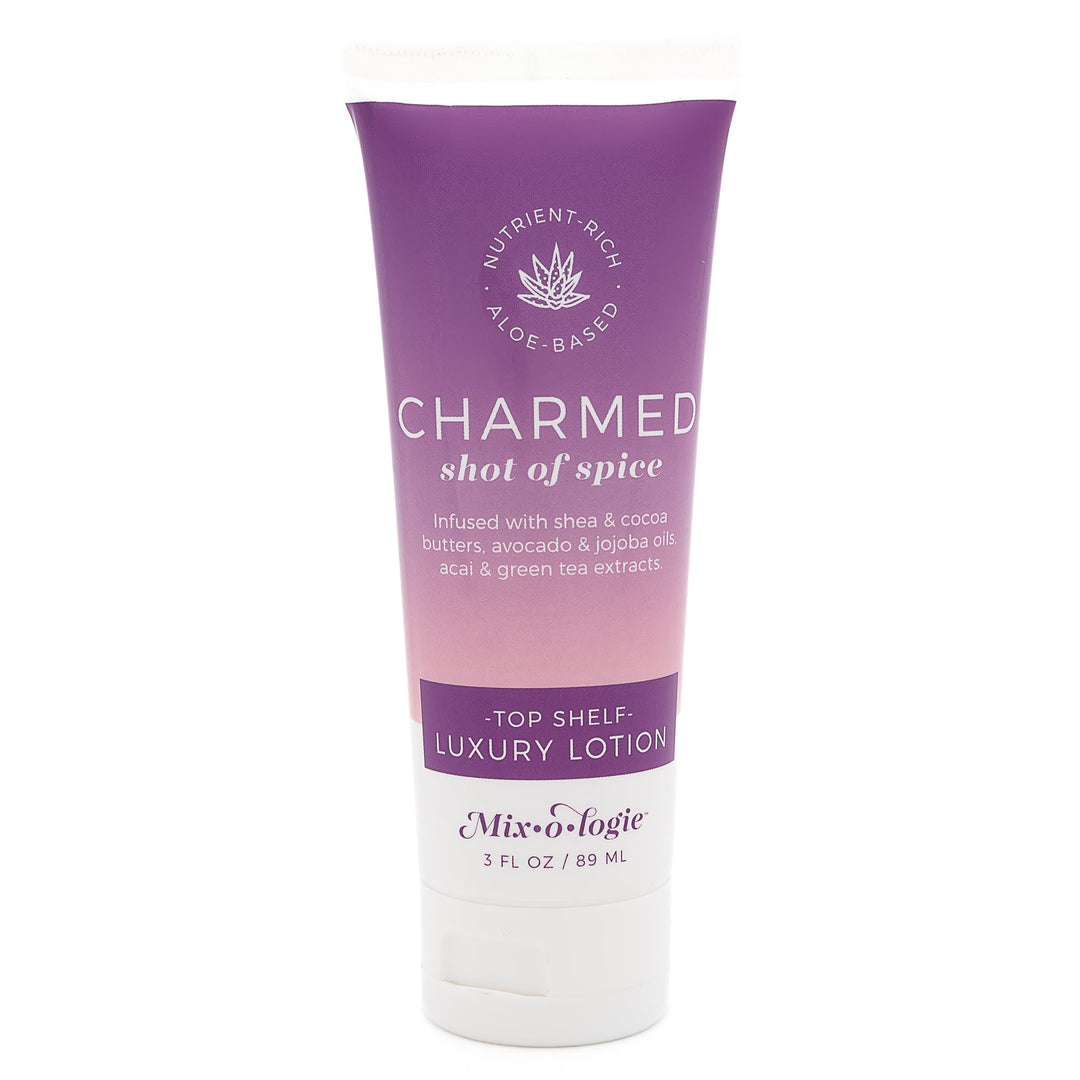 Mixologie Top Shelf Luxury Lotion in Charmed Shot of Spice, 3 fl oz, squeeze tube with purple to blush pink gradient label and aloe vera badge on white background