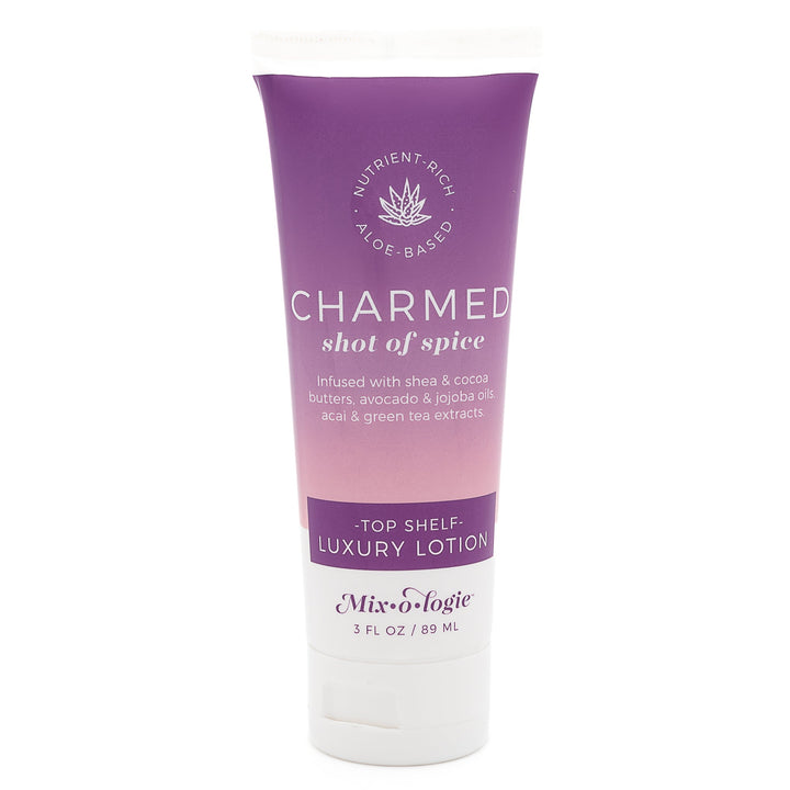 Mixologie Top Shelf Luxury Lotion in Charmed Shot of Spice, 3 fl oz, squeeze tube with purple to blush pink gradient label and aloe vera badge on white background
