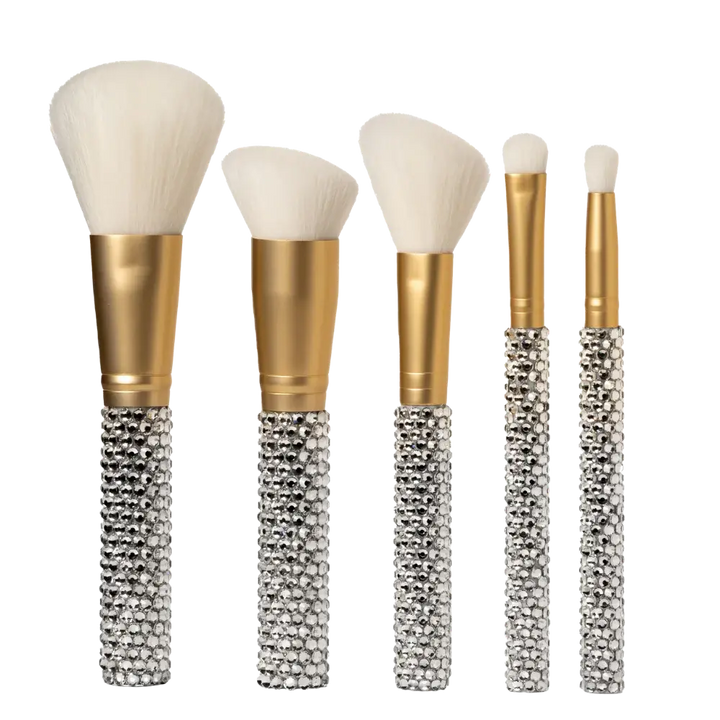 Rhinestone 5-Piece Makeup Brush Set by Genie on white background, showing all five brush sizes from powder to detail with crystal-encrusted handles and gold ferrules