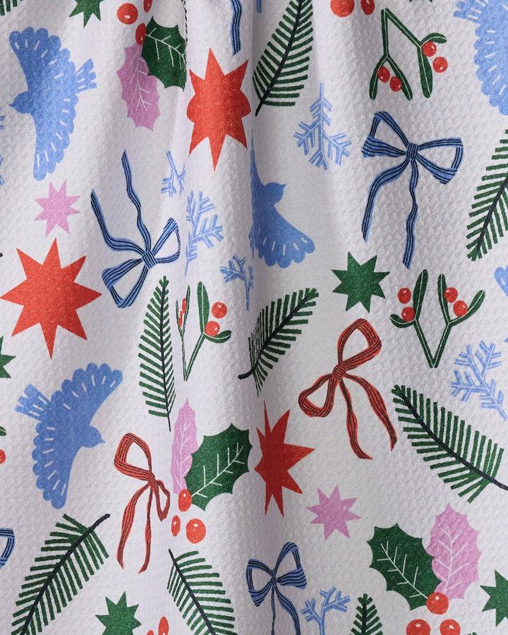 Christmas Garden Party Tea Towel by Geometry