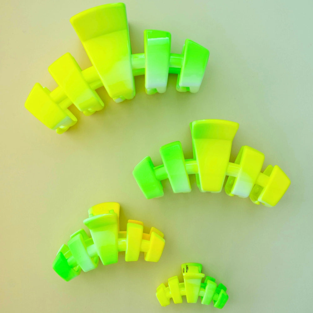 Teleties yellow to neon green ombre claw clip set of four in assorted sizes on yellow-green background