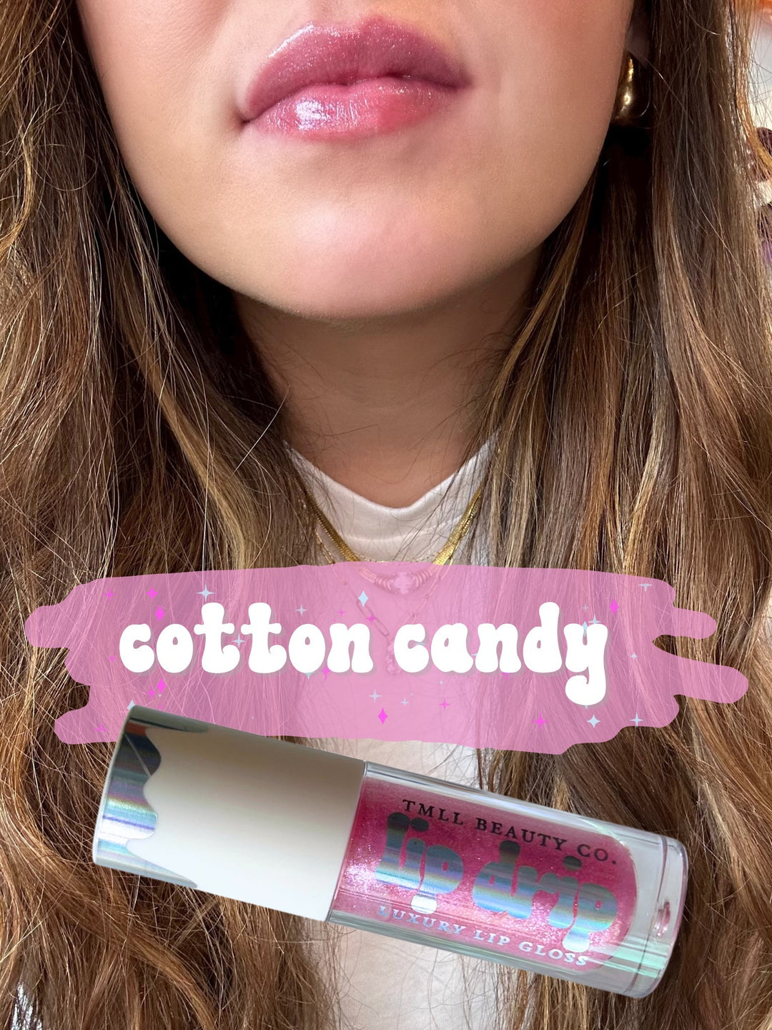 TMLL Beauty Co. Lip Drip Luxury Lip Gloss in Cotton Candy — a sheer pink glitter shade shown on lips with tube below