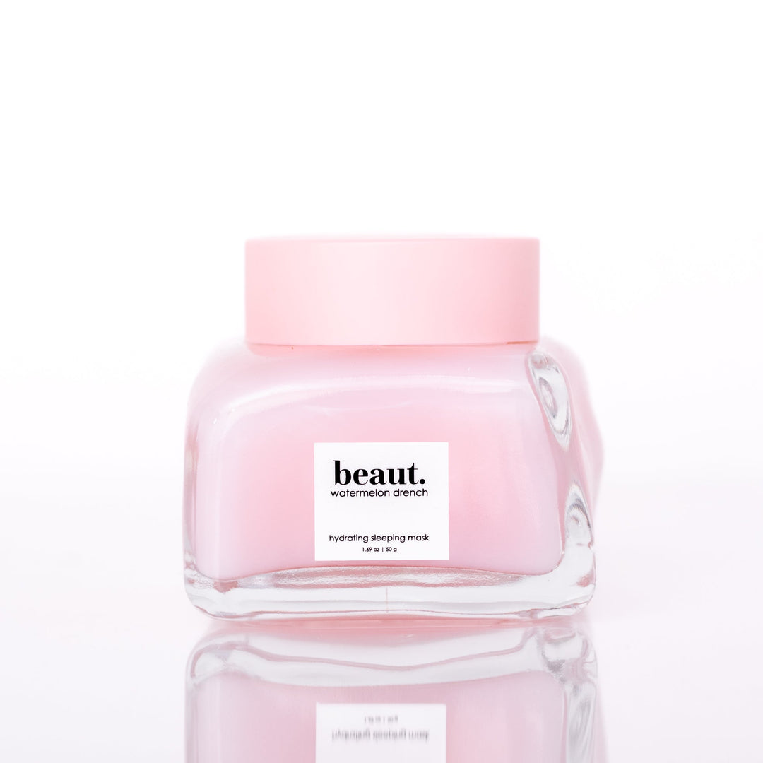 Beaut Watermelon Drench Hydrating Sleeping Mask 50g closed glass jar with pink lid on white reflective surface
