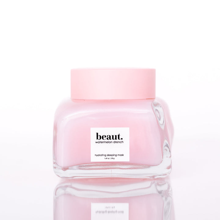 Beaut Watermelon Drench Hydrating Sleeping Mask 50g closed glass jar with pink lid on white reflective surface
